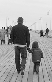 Father and son at pier